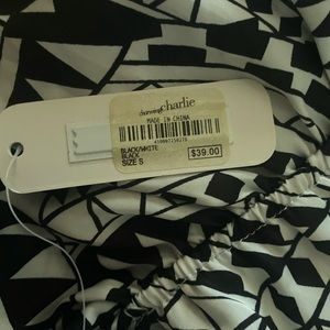 woman’s black-and-white pattern dress long and back shorted in front size small